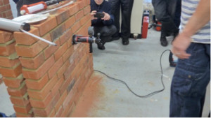 A pull test being carried out during an “updating Skill” Talk. This tests the strength of the adhesive holding the ties insitu