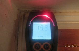 Moisture meter showing an 'At Risk' warning