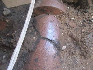 Investigation showed a pipe to be buried in the floor was leaking causing the outbreak of Dry-Rot