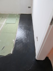 The DPM has been painted over the original floor slab to prevent moisture from rising up 