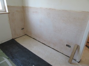 The wall has been plastered with a sand and cement render incorporating a waterproof additive.